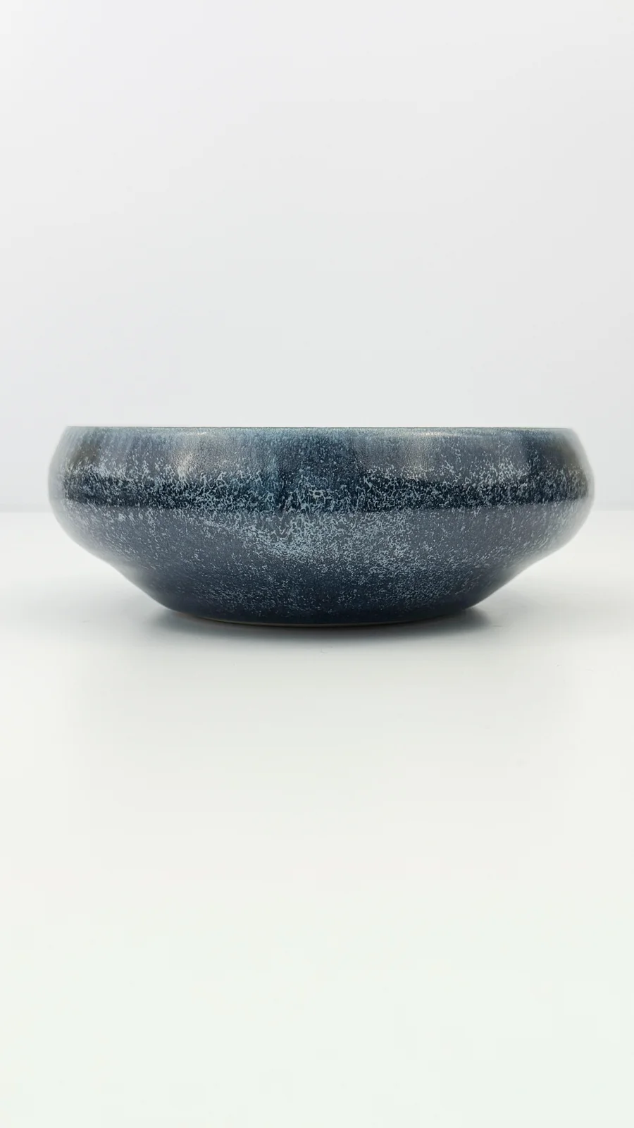 mtvessell_pottery_azure_10-6 Side view of a handcrafted ceramic vessel from mtvessell Pottery's Azure collection